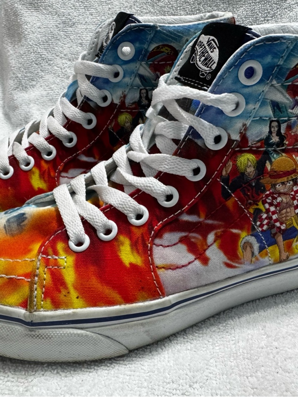 Vans One Piece High-Top Sneakers in Red, Orange, Blue with Anime Graphic
